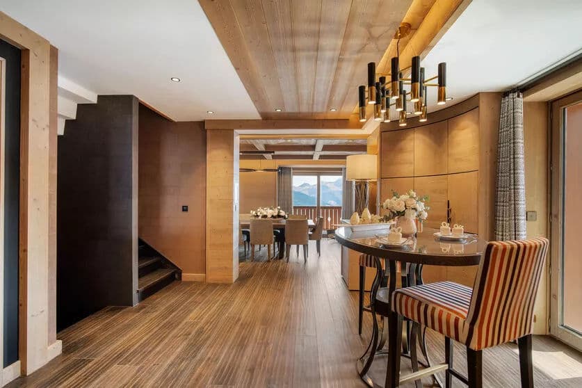 Dining area with the fitted kitchen and balcony beyond