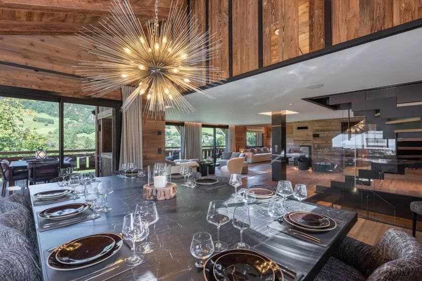 Open-plan dining and living area with timber ceiling and terrace glazing