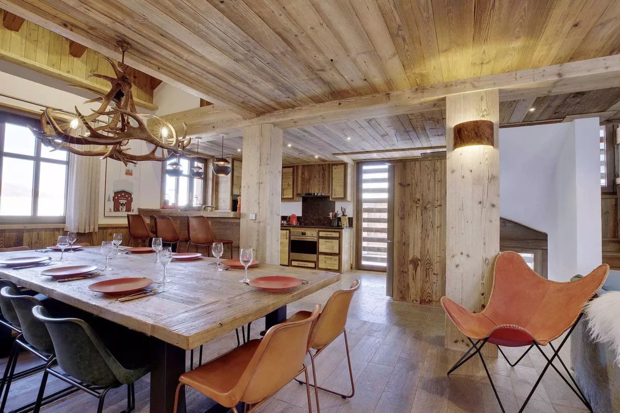 Dining area with the open kitchen and lounge beyond