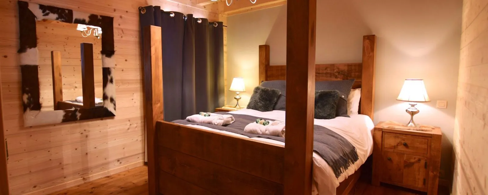 Ground-floor bedroom with a wooden four-poster double bed