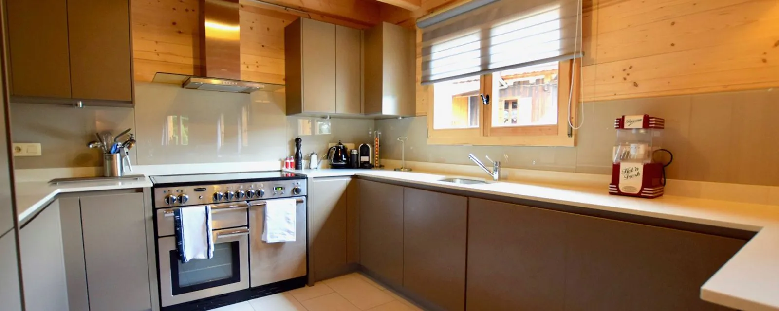 Modern kitchen with a large range cooker and window