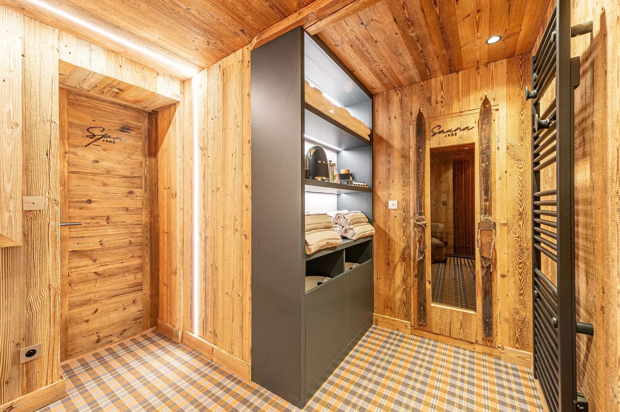 Sauna entrance and open storage beside the wellness area