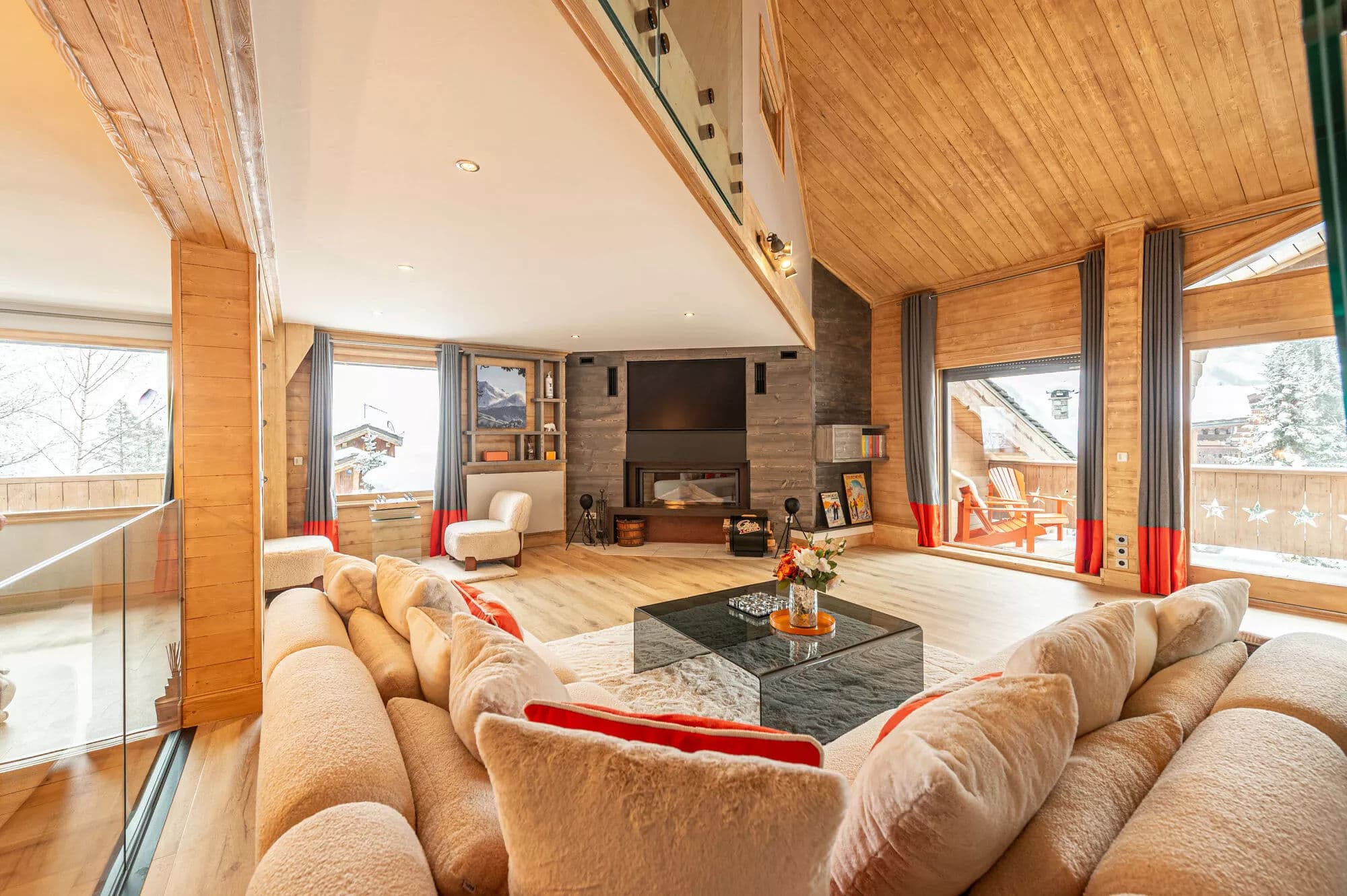 Lounge seating beside the fireplace and terrace windows