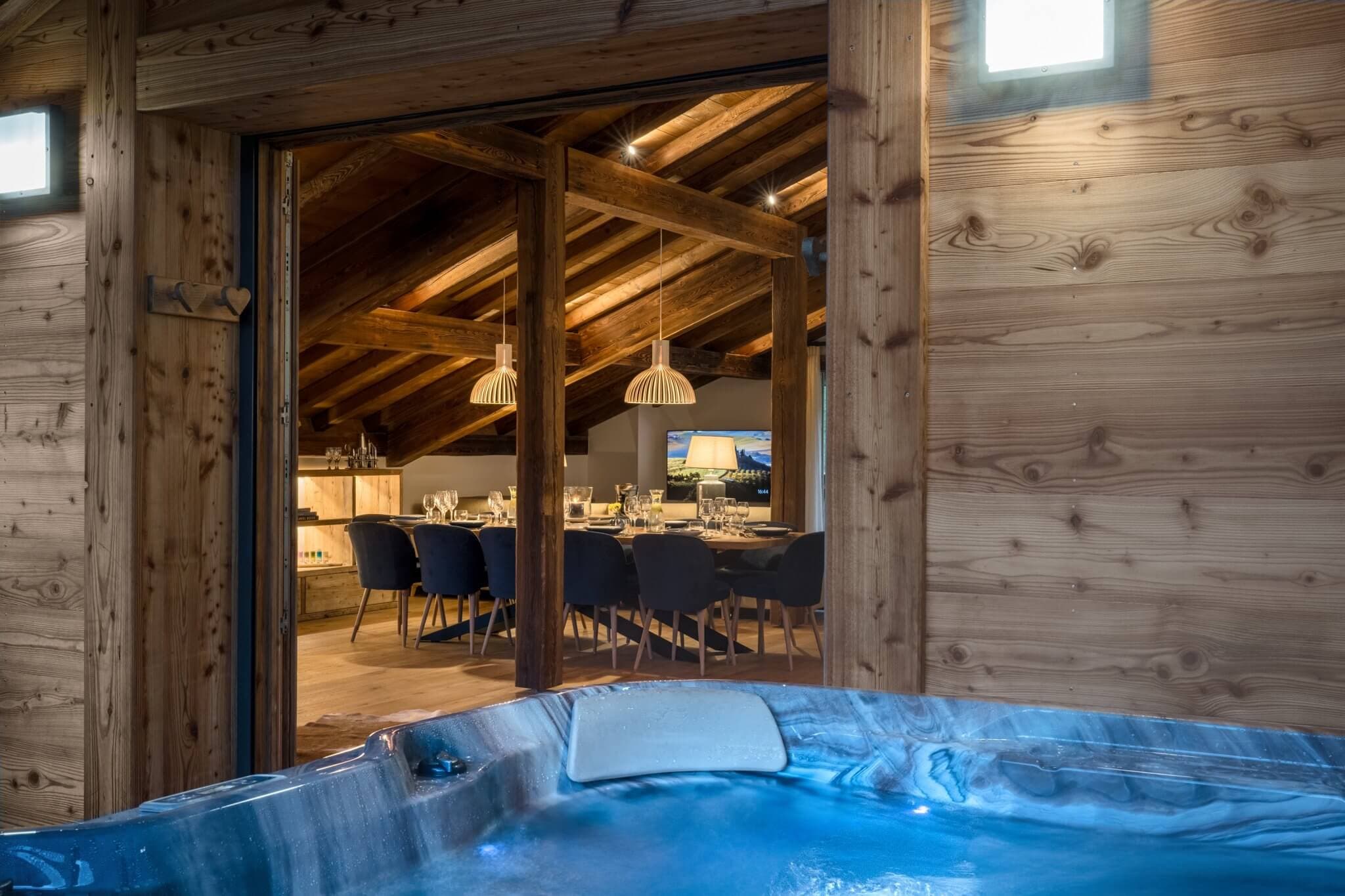 Covered balcony with hot tub beside the open-plan living area