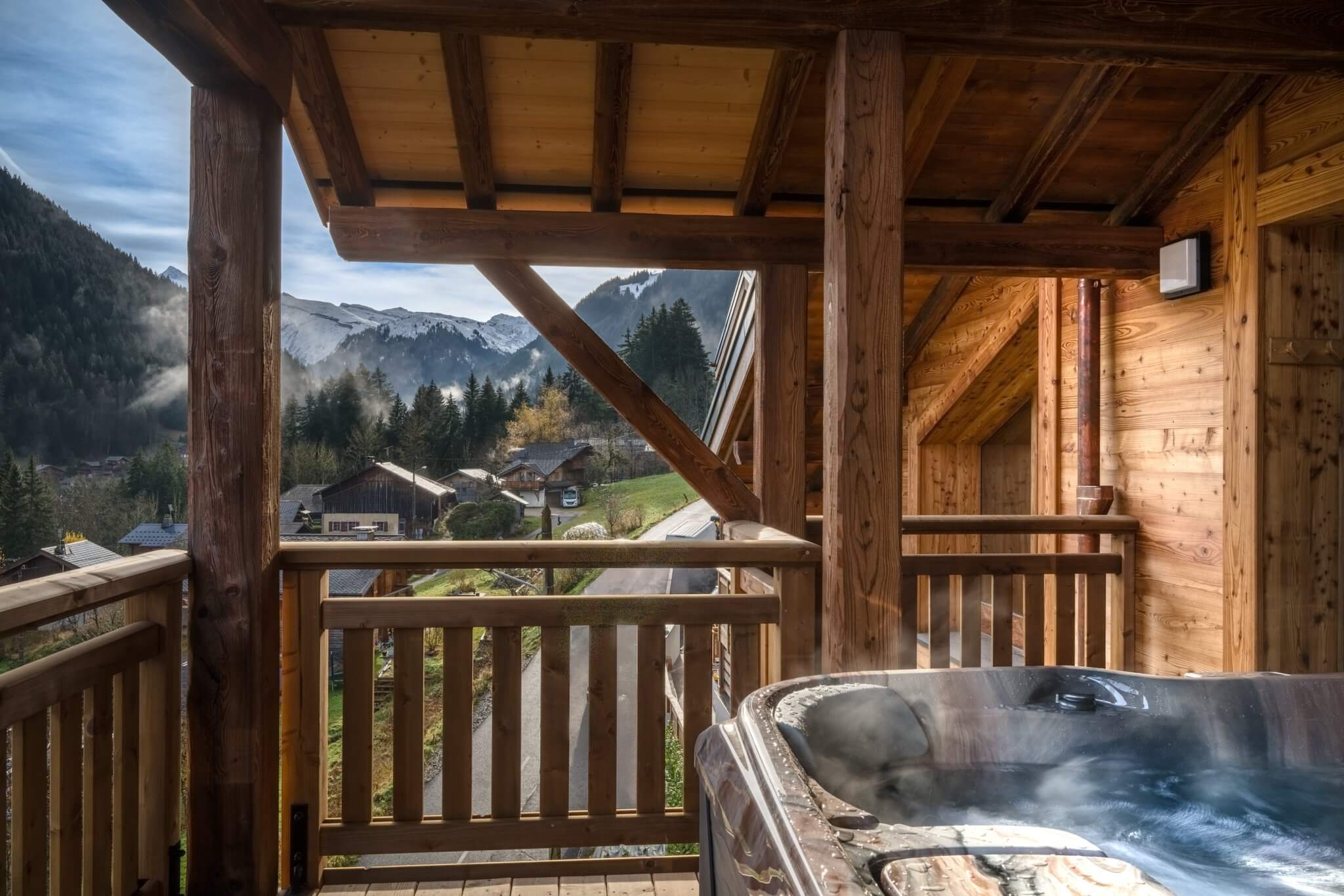 Balcony hot tub with panoramic views across the village and mountains