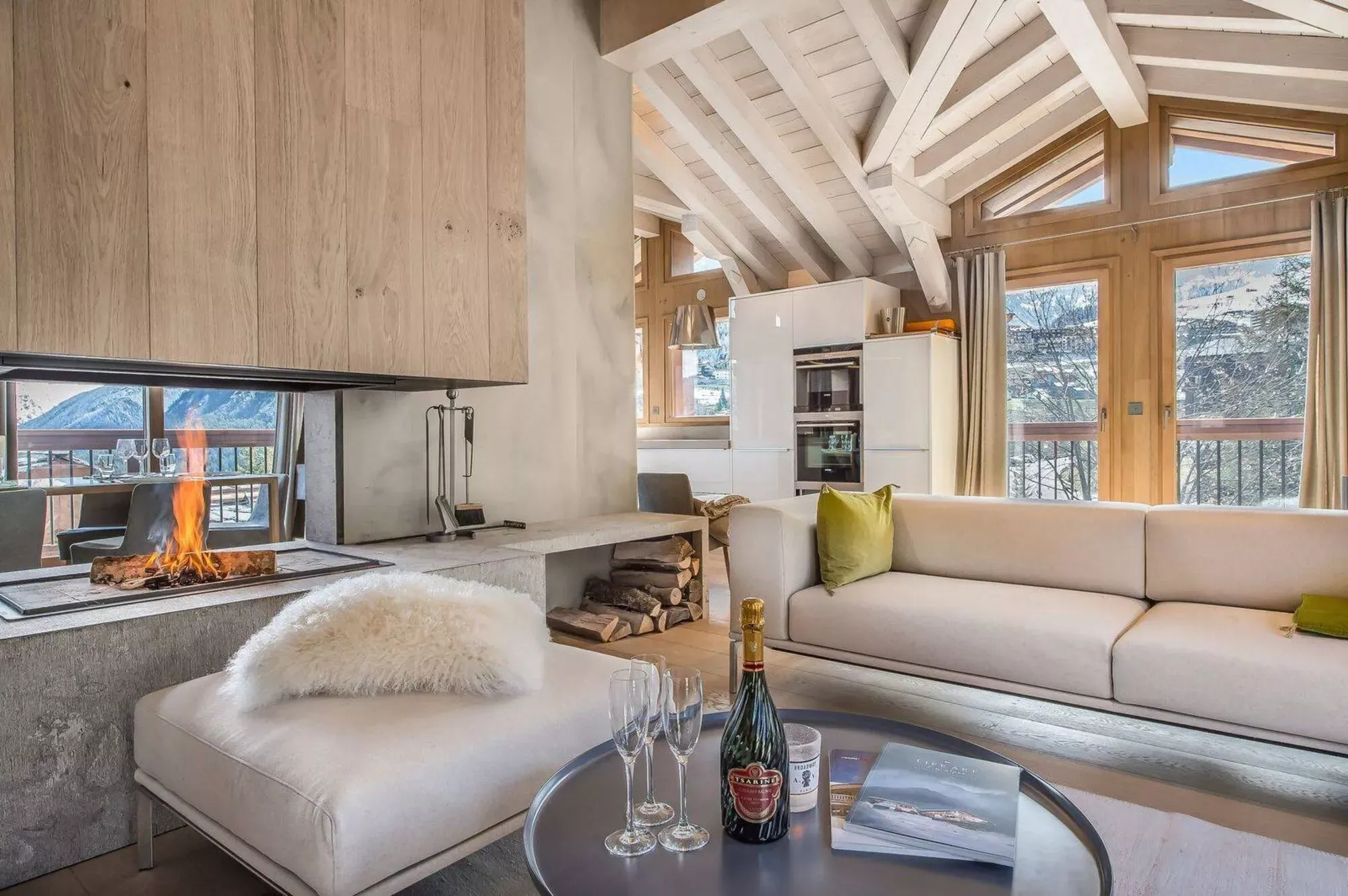 Top-floor lounge with sofas gathered around the central fireplace