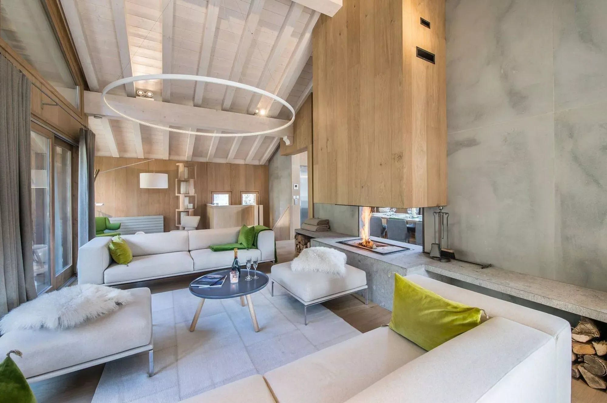 Living room with neutral sofas, wood finishes and terrace doors