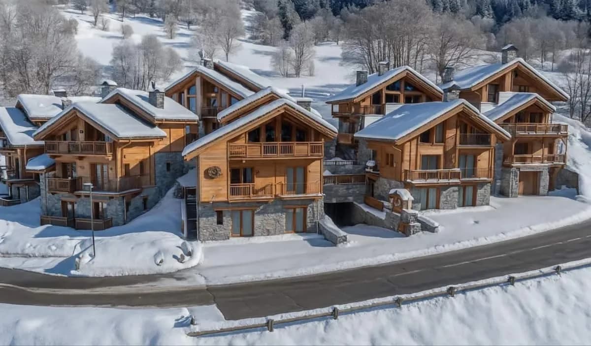 Snow-covered chalets beside route de la Gittaz