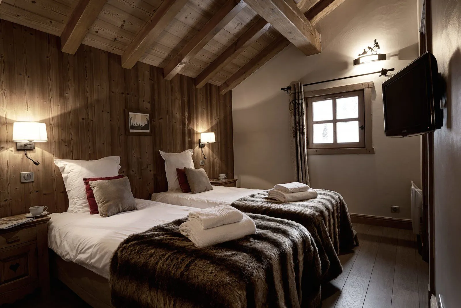 Bedroom with timber panelling and exposed beams