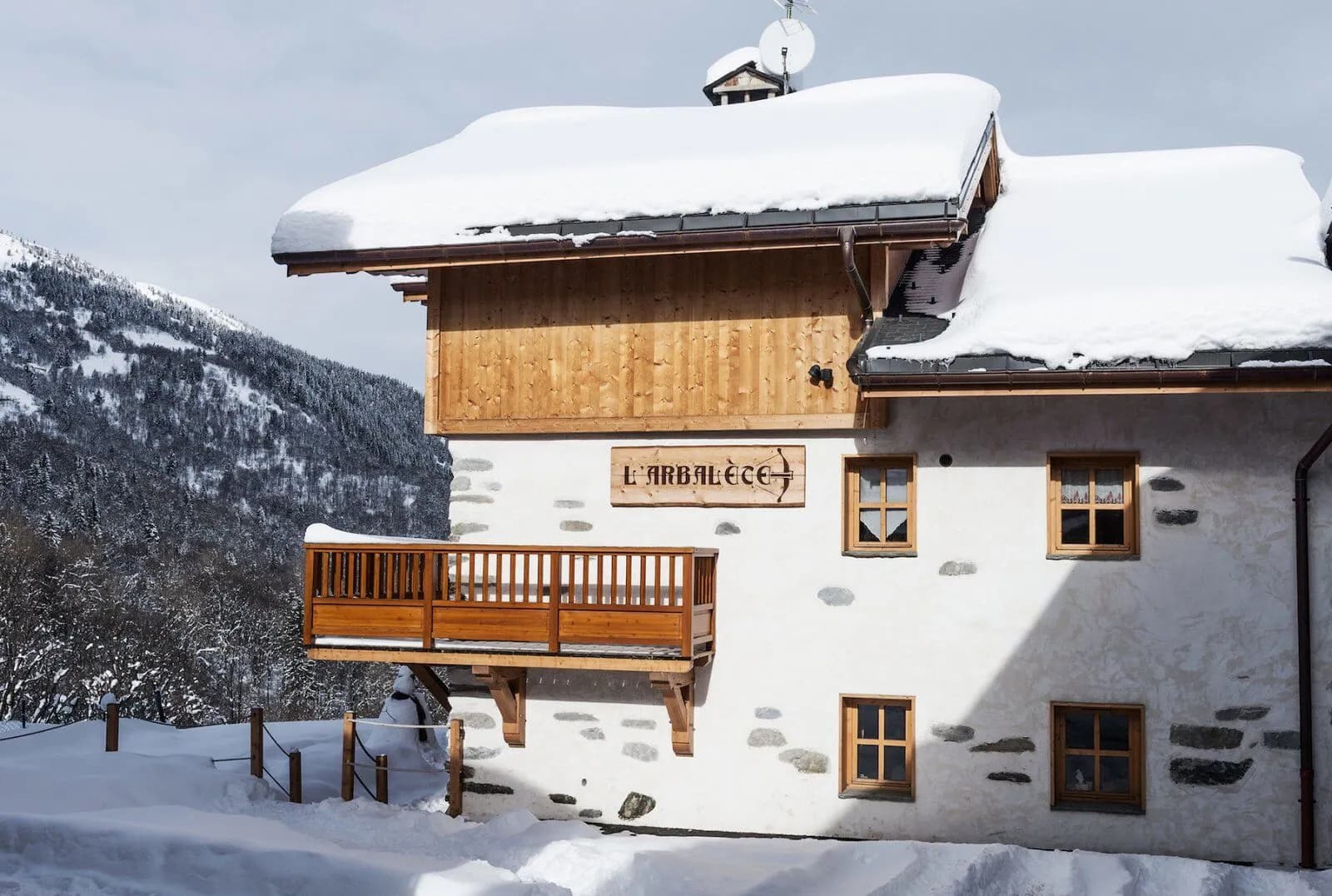 Chalet exterior overlooking a wooded mountainside
