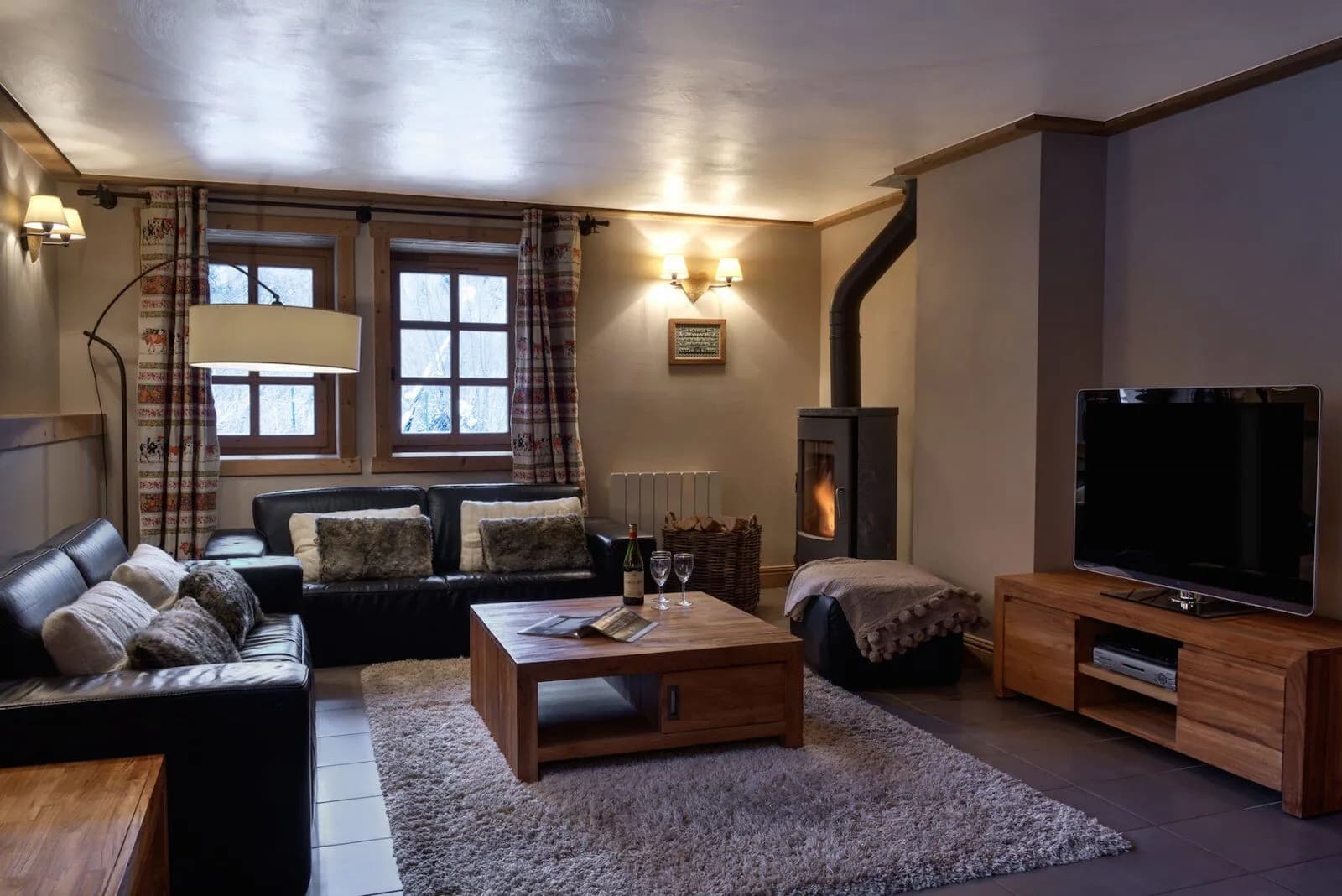 Living room with sofas and a log fireplace