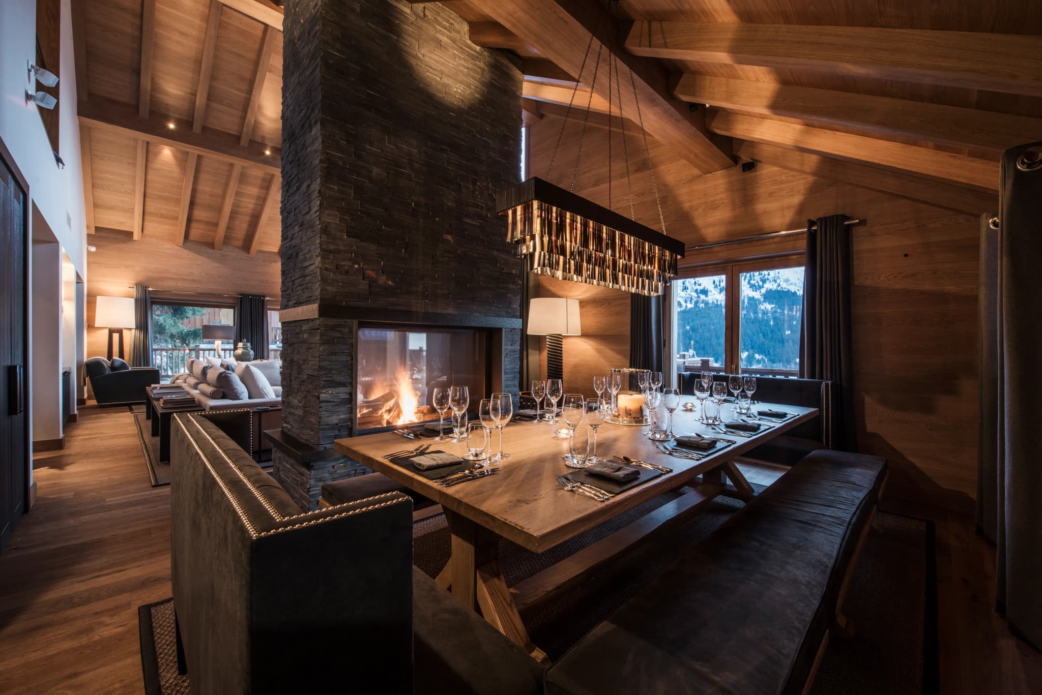 Dining table beside the dual-aspect fireplace