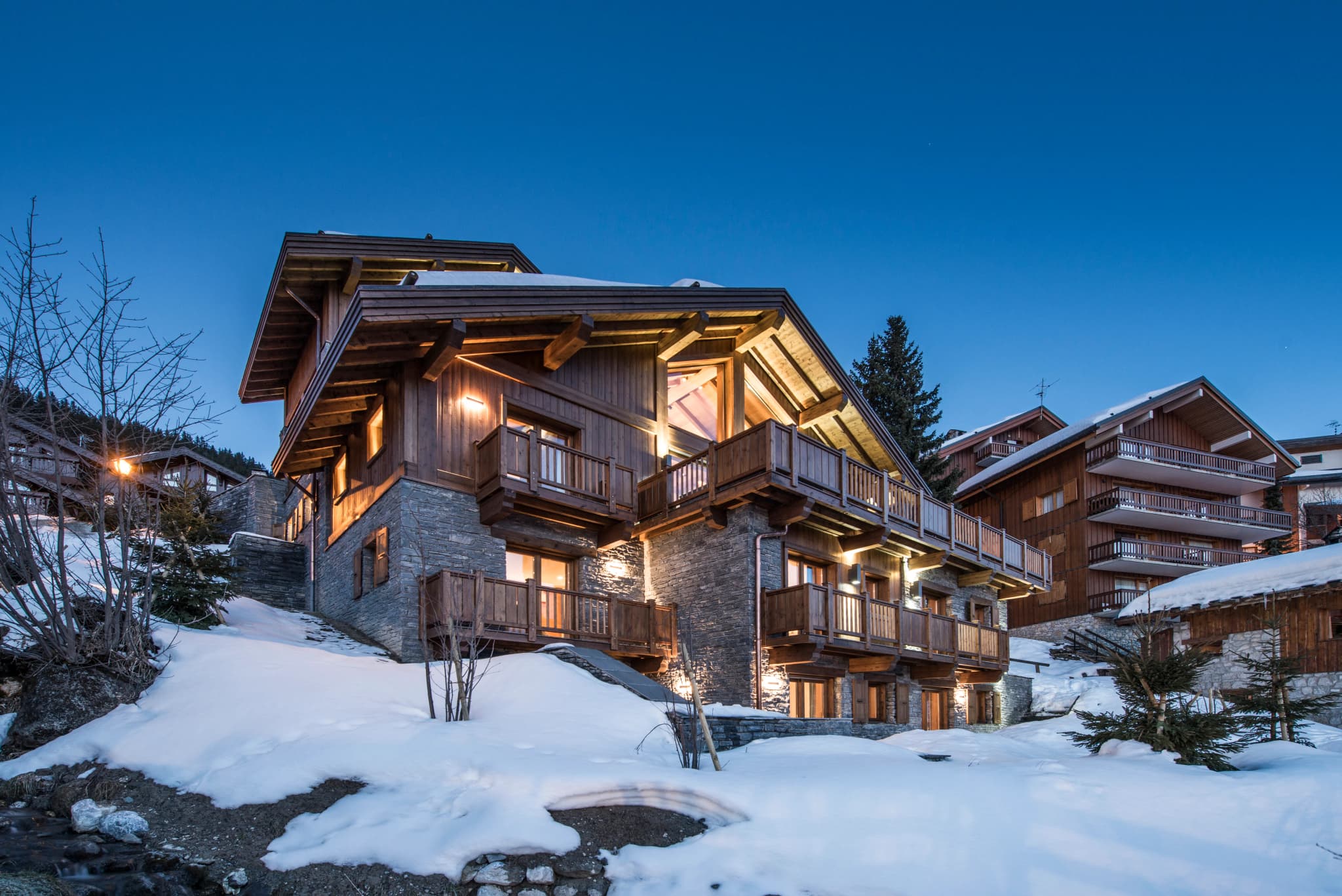 Timber chalet with balconies in the snow