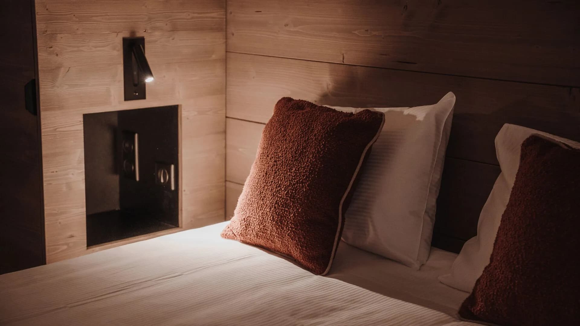 Bedside detail in a timber bedroom