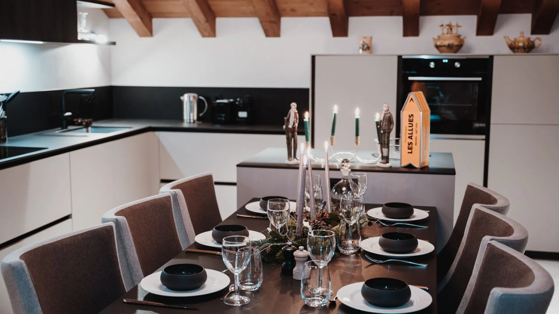 Dining table beside the open-plan kitchen