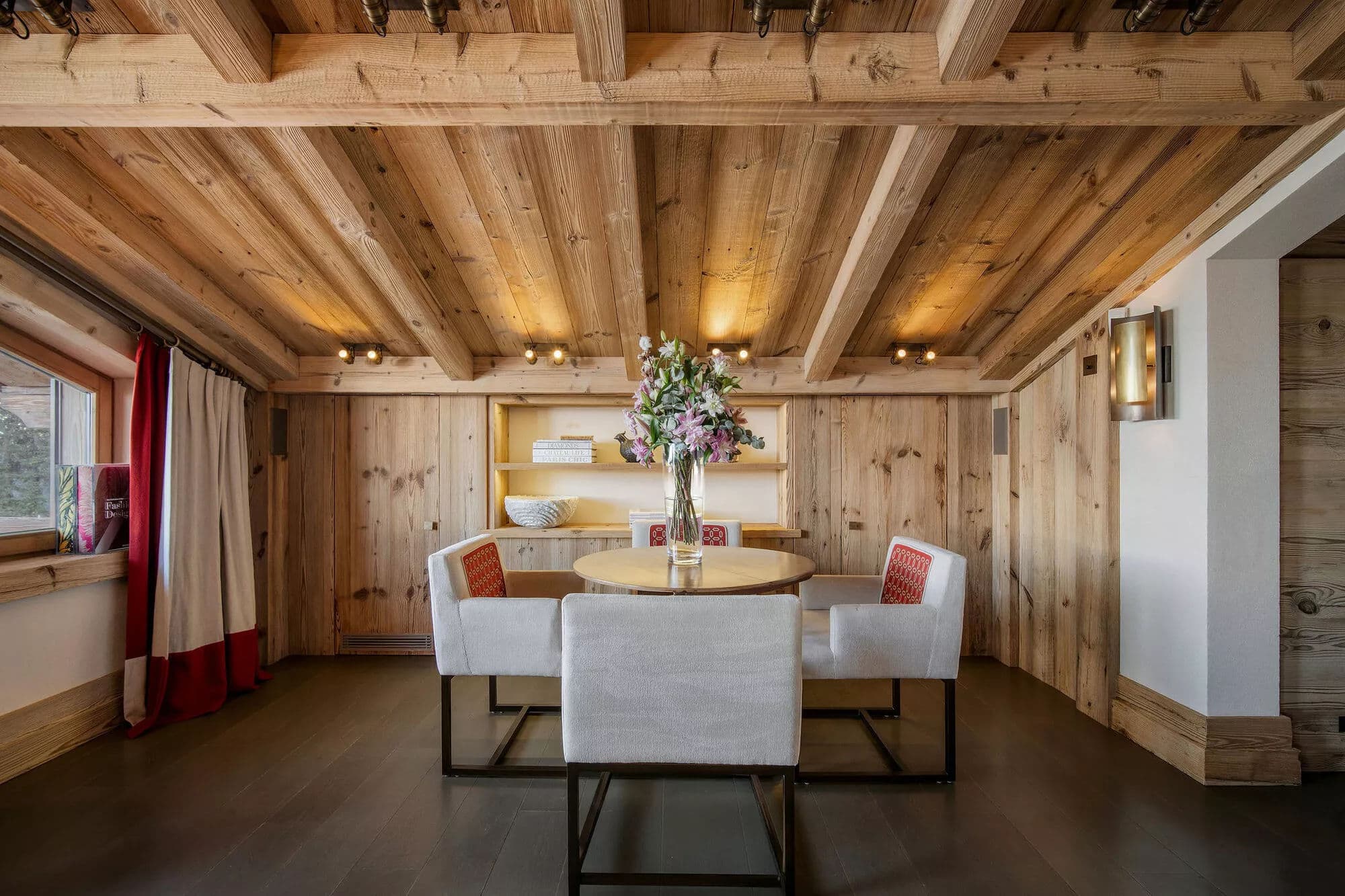 Dining area with built-in bar seating and timber cabinetry
