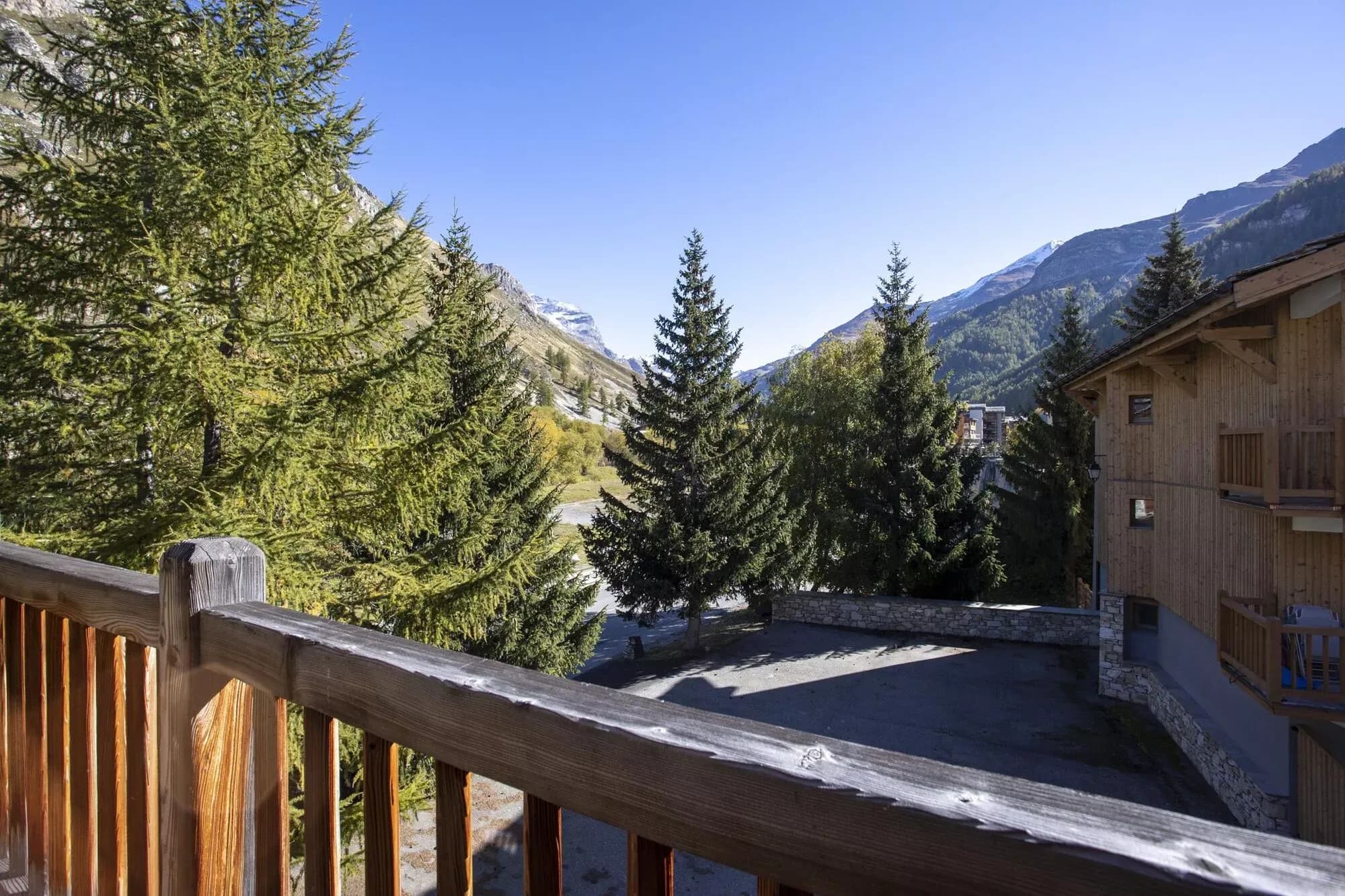 View across village rooftops to the surrounding mountains