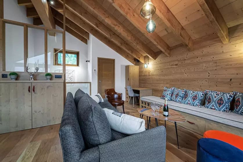 Television lounge and sitting area beside the open-plan living space