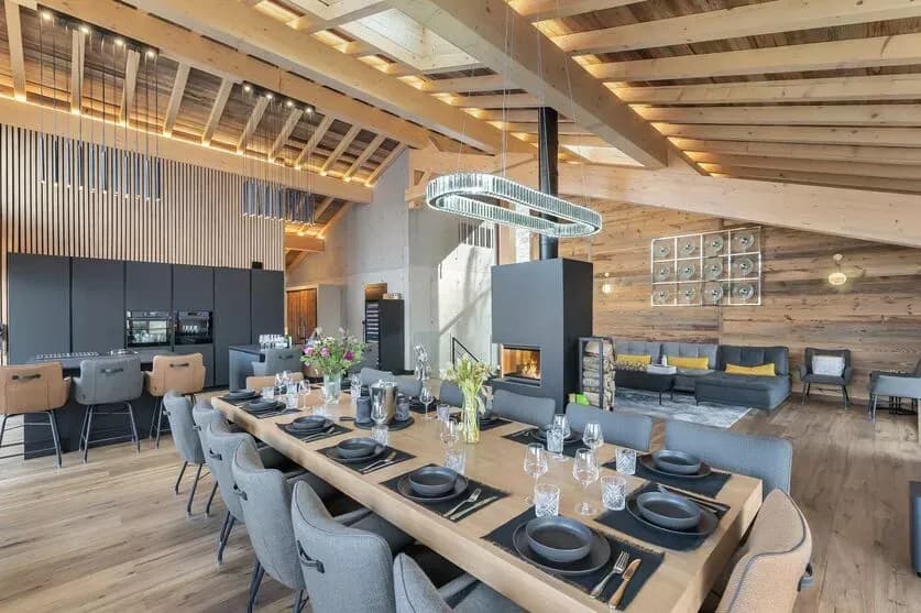 Open-plan dining and living room with a central fireplace