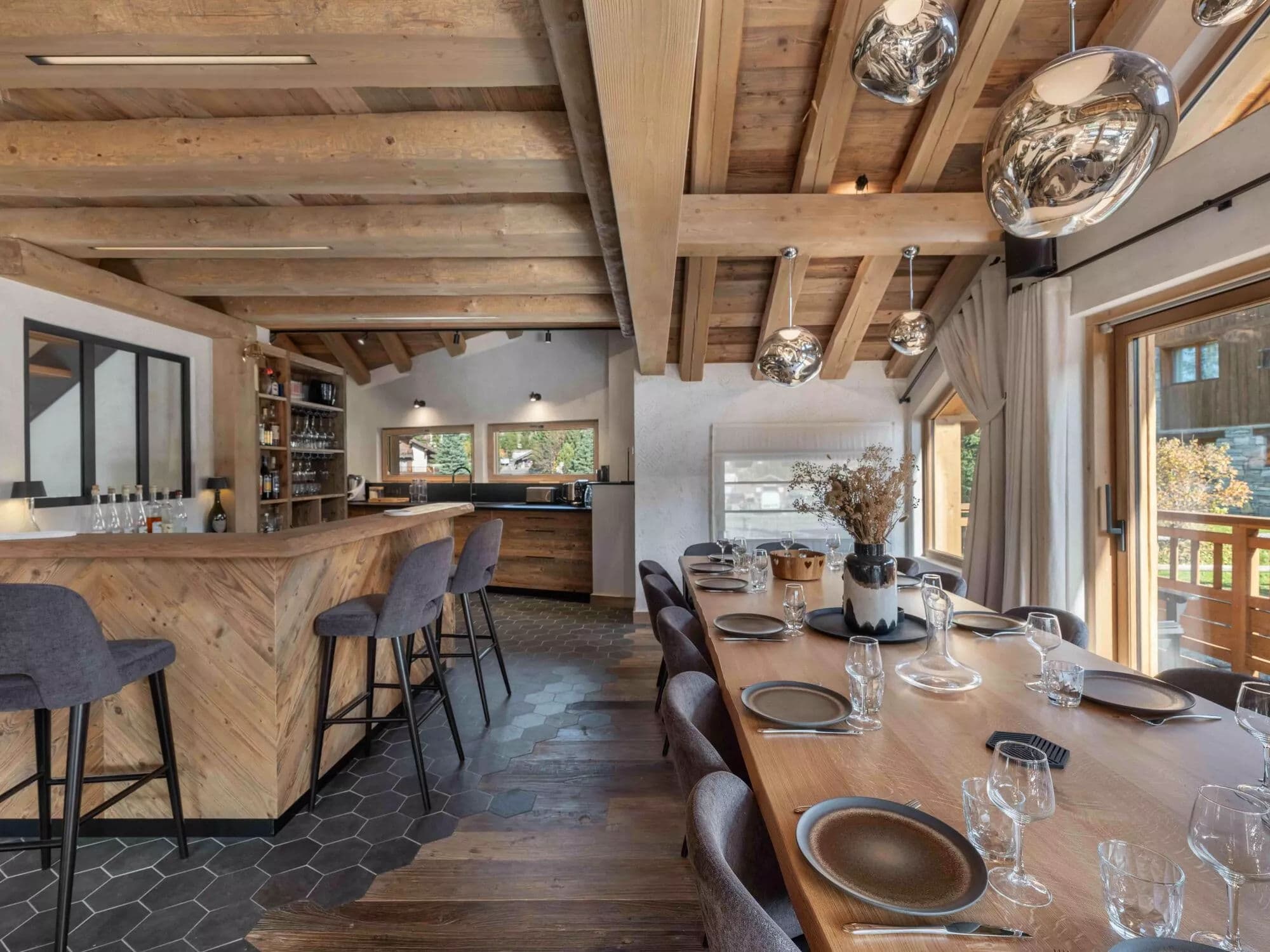 Bar seating beside the open kitchen and dining table
