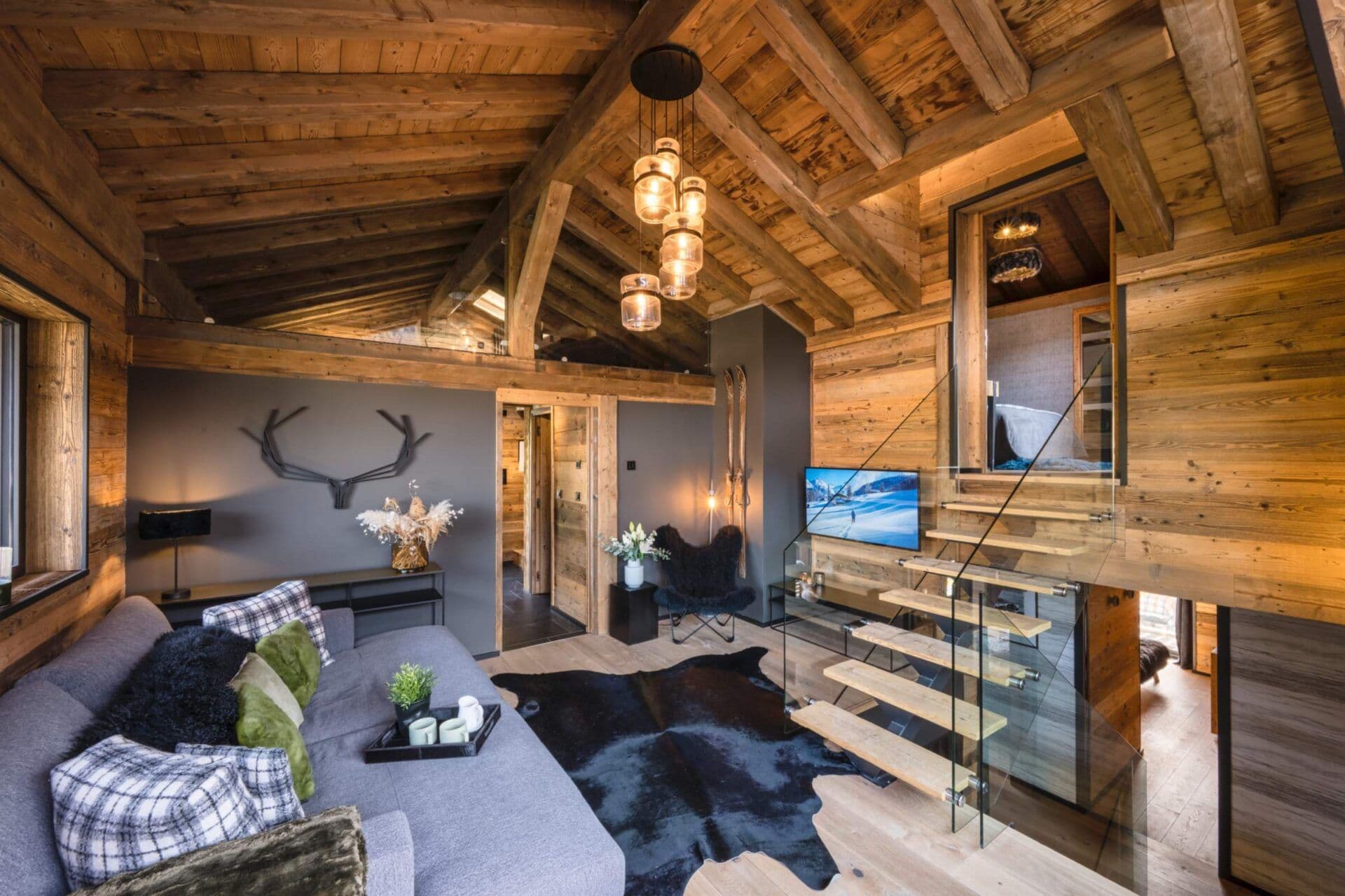 Open-plan interior with timber finishes and floor-to-ceiling windows