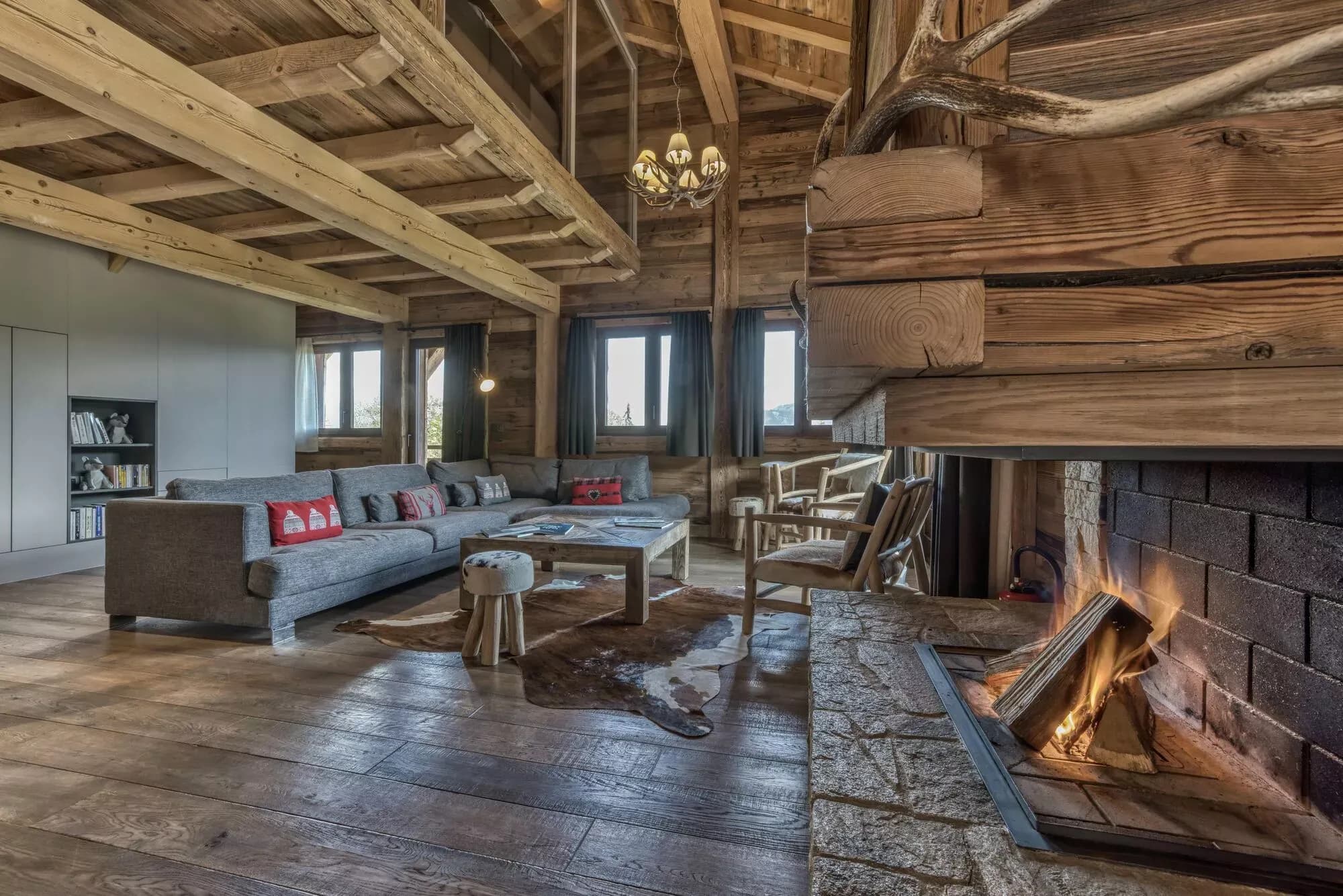 Living room with fireplace, television and timber ceiling