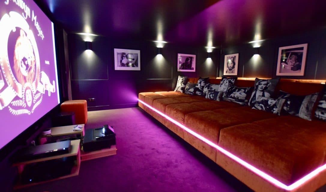 Private cinema with tiered seating and a large projection screen