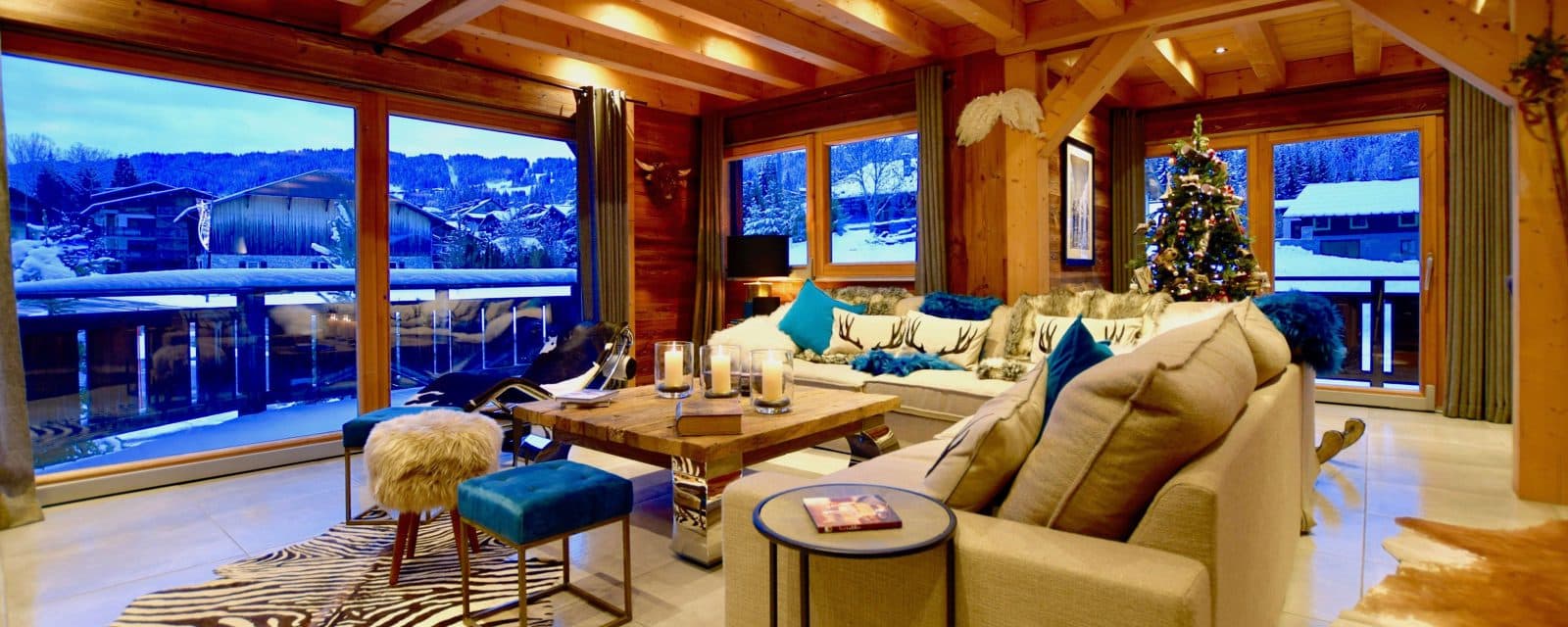 Open-plan lounge with floor-to-ceiling windows and balcony access