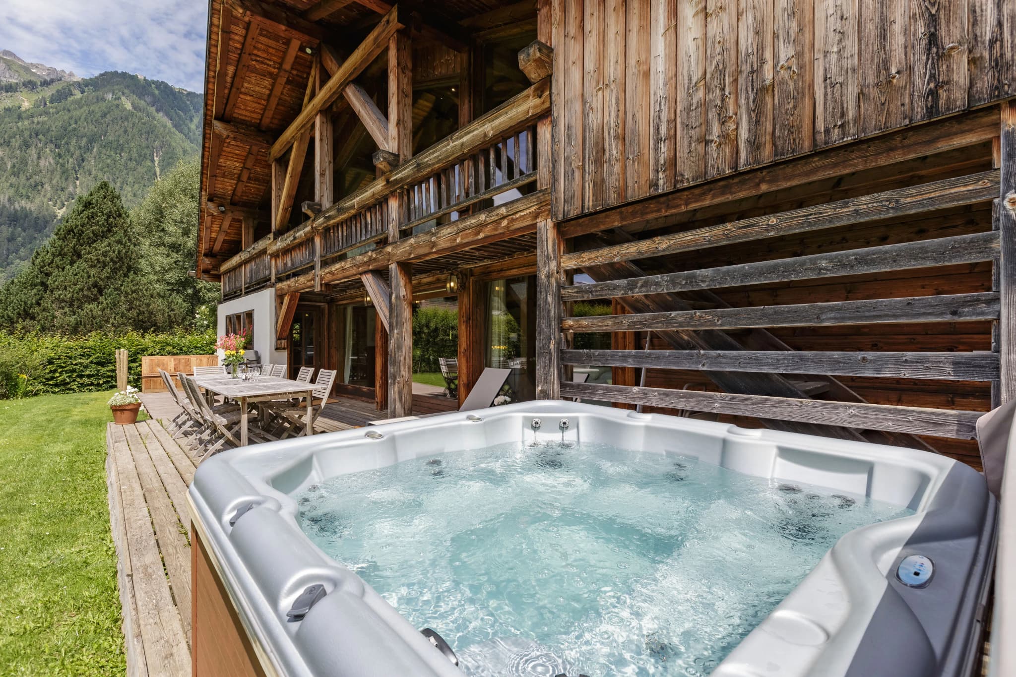 Outdoor hot tub beside the terrace