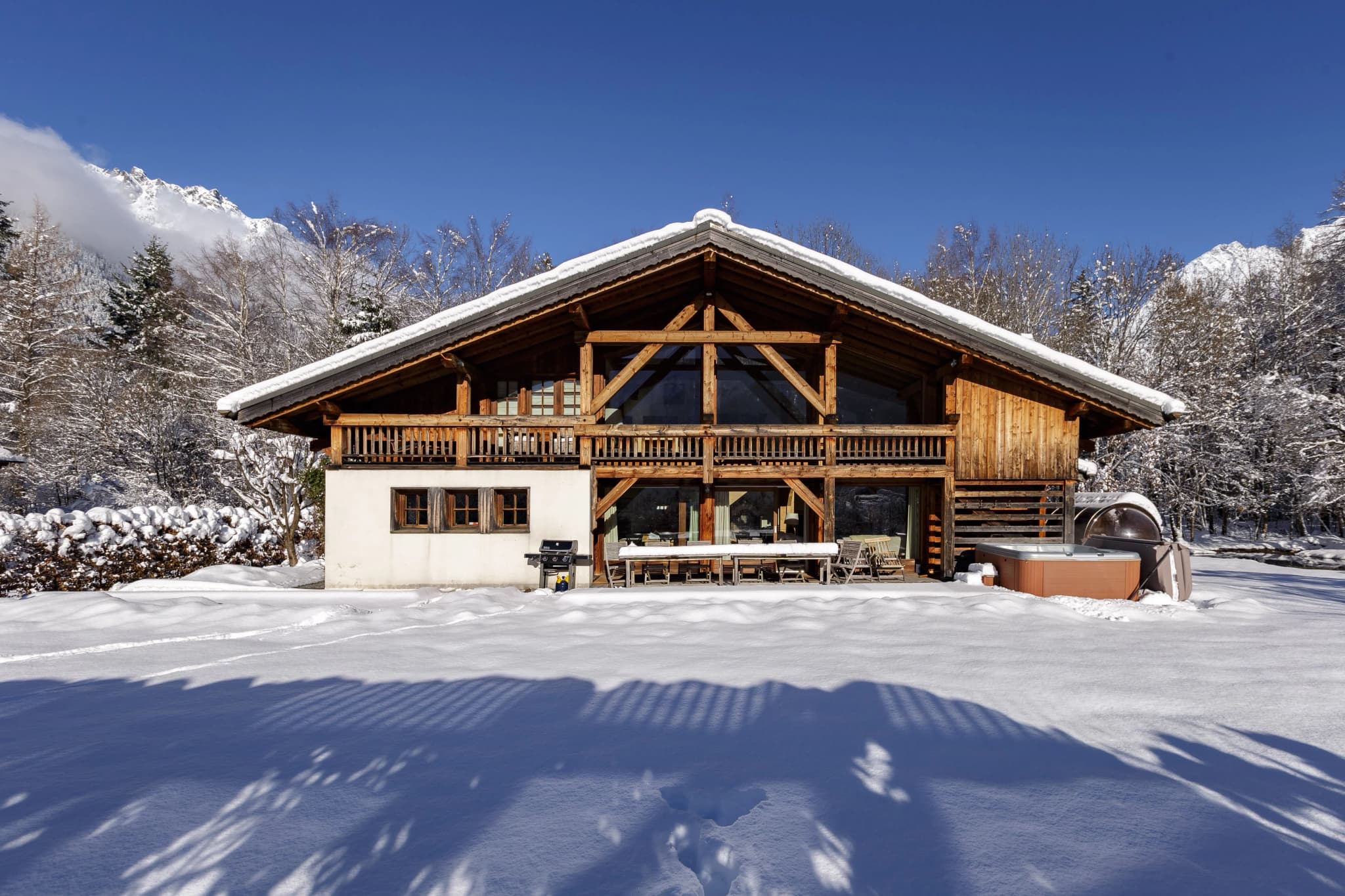 Chalet exterior and garden in snow