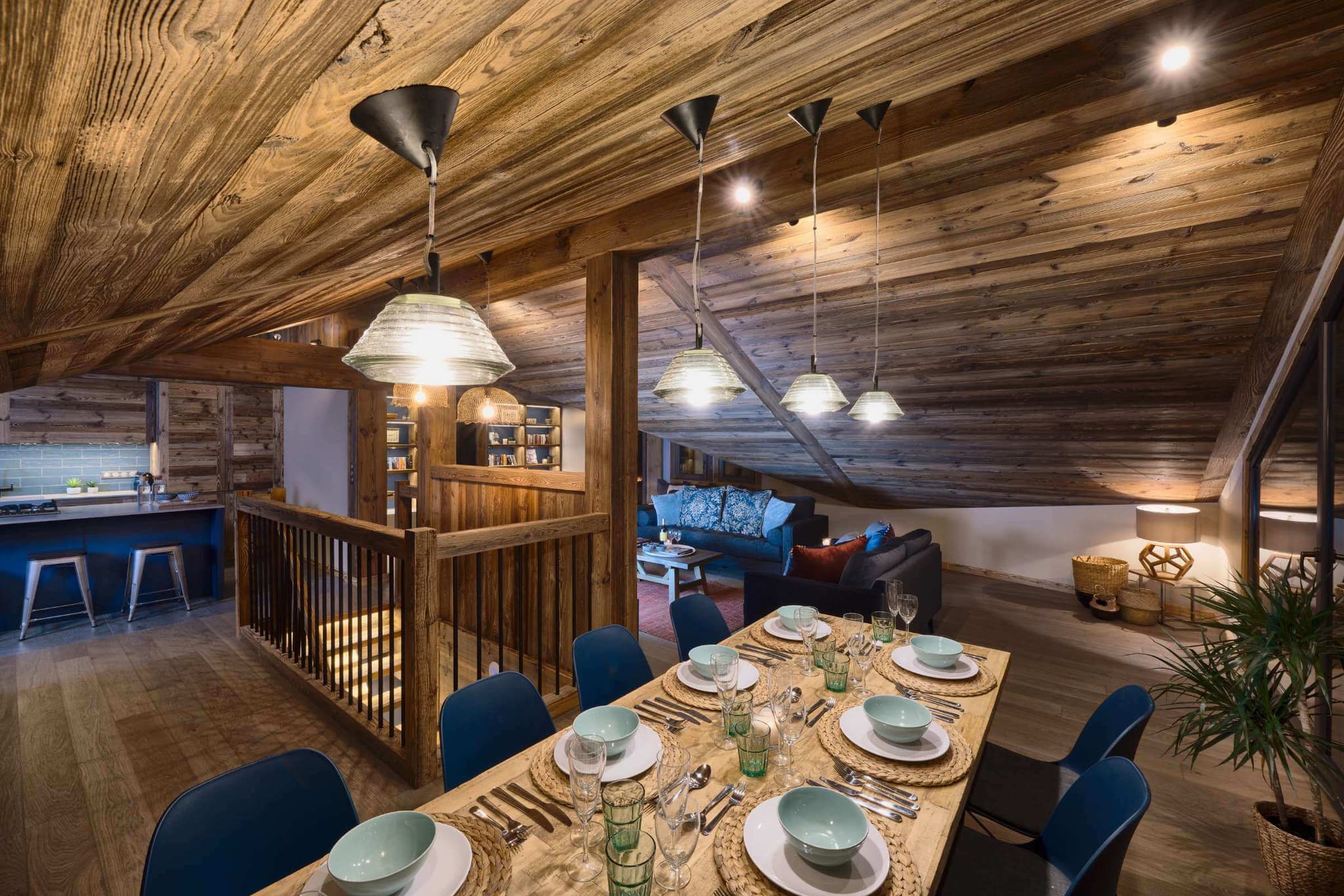 Dining table beside the open-plan kitchen and living area