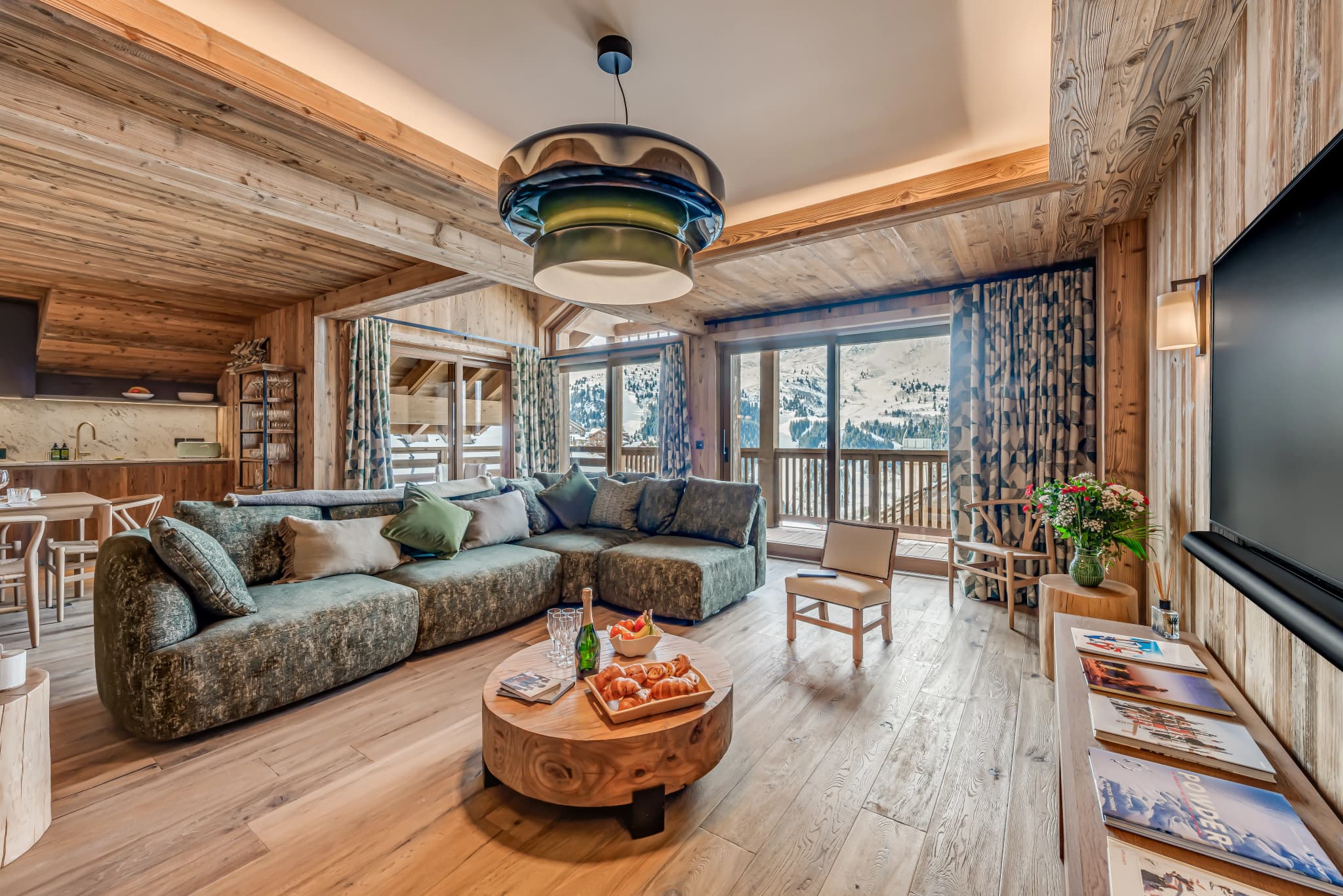 Lounge with fireplace and mountain views