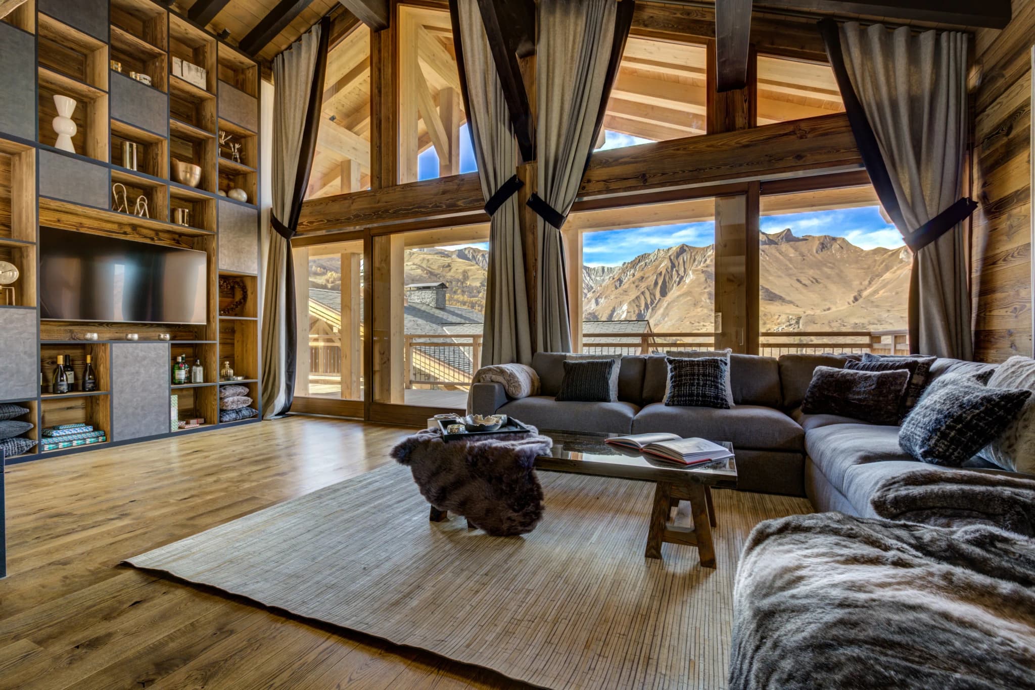 Double-height living room with mountain views