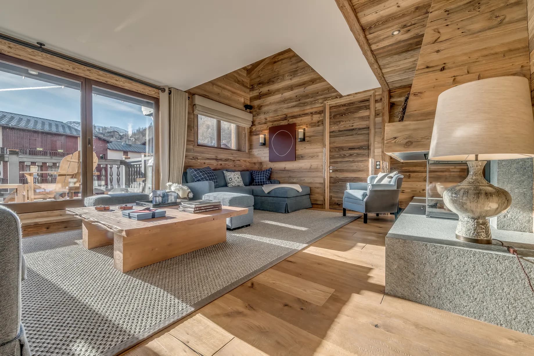 Living room opening onto a mountain-view balcony