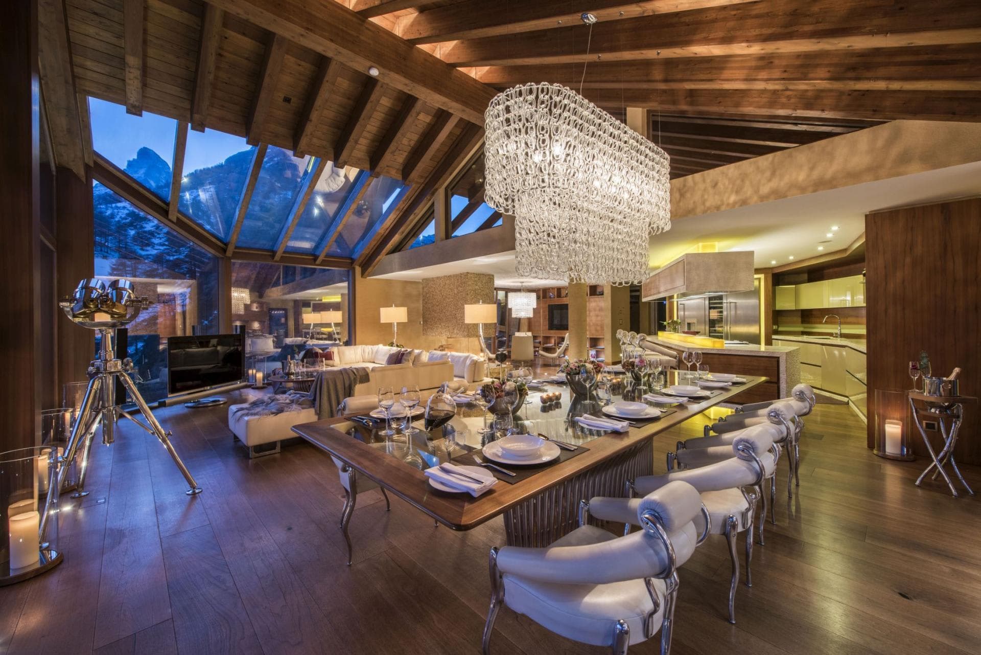 Dining area seats 10; floor-to-ceiling windows with mountain views