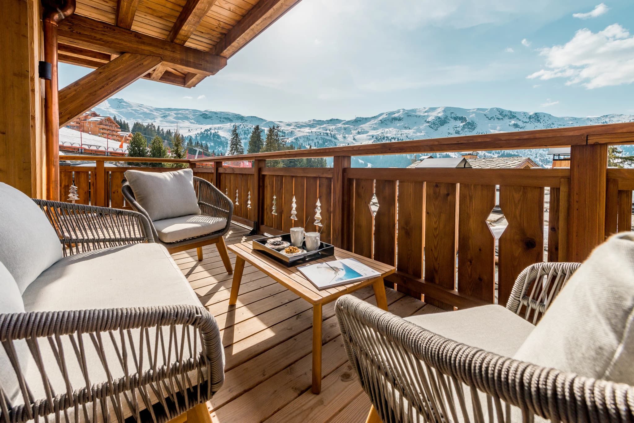 Wrap-around balcony with seating and mountain views
