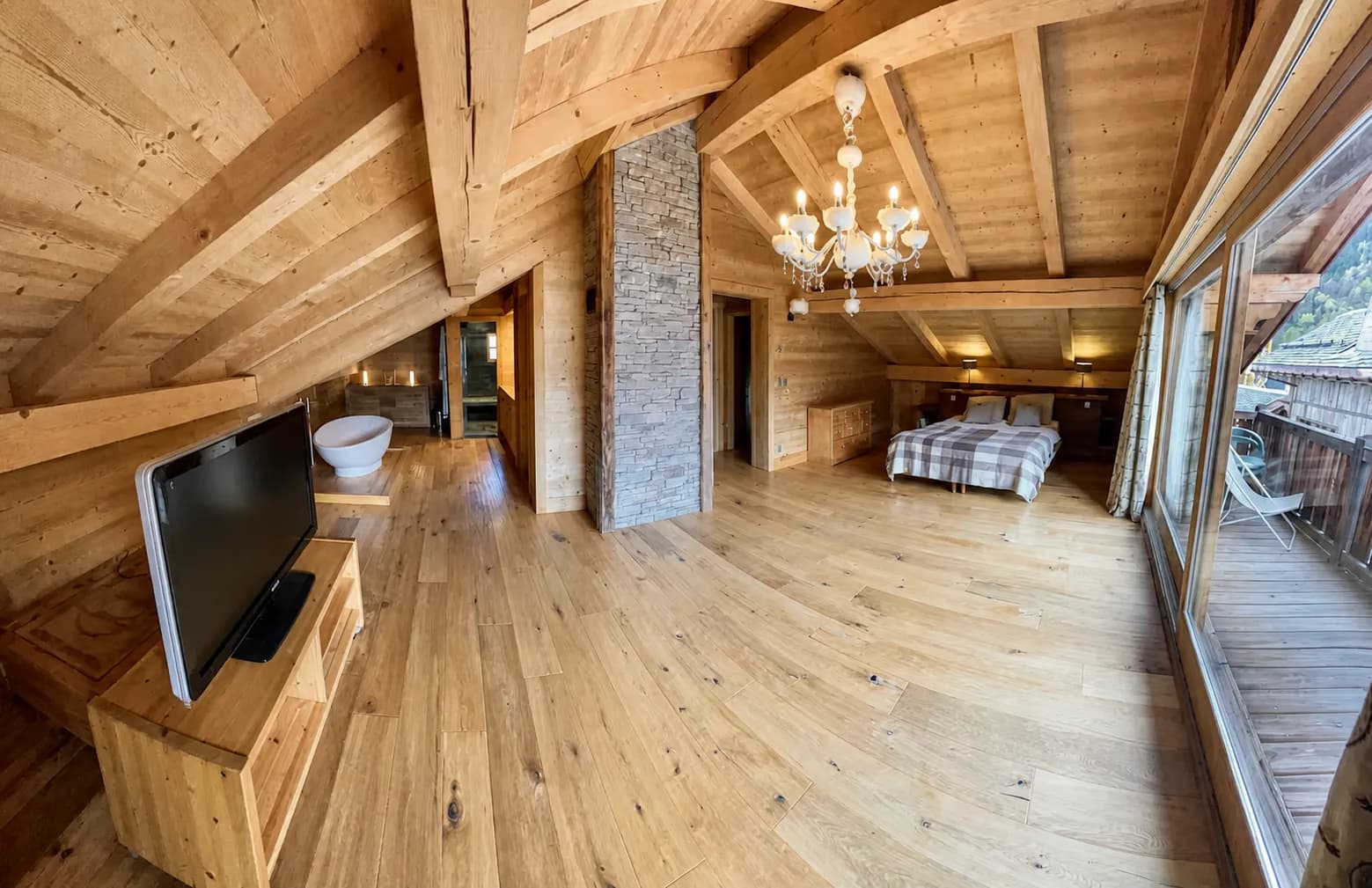 Penthouse living area with fireplace and balcony