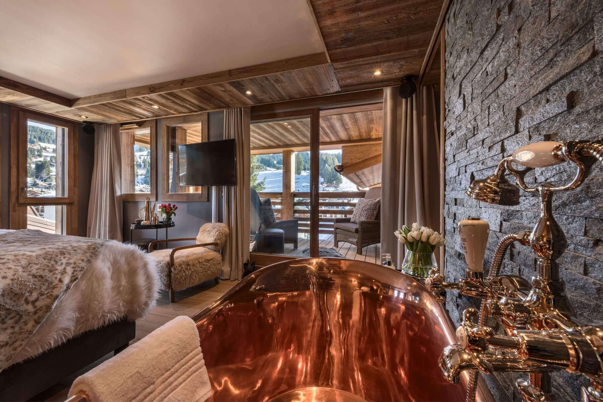 Master bedroom with a freestanding copper bath