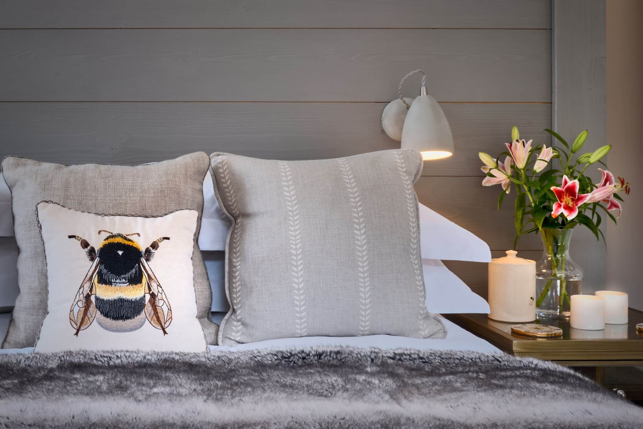 Bee-print cushion and bedroom seating detail
