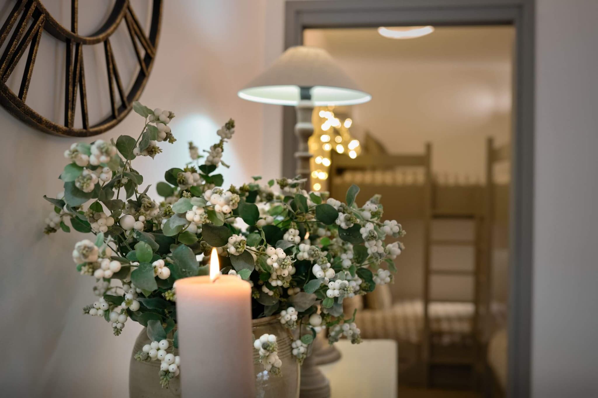 Flowers and candle detail beside the open-plan dining area