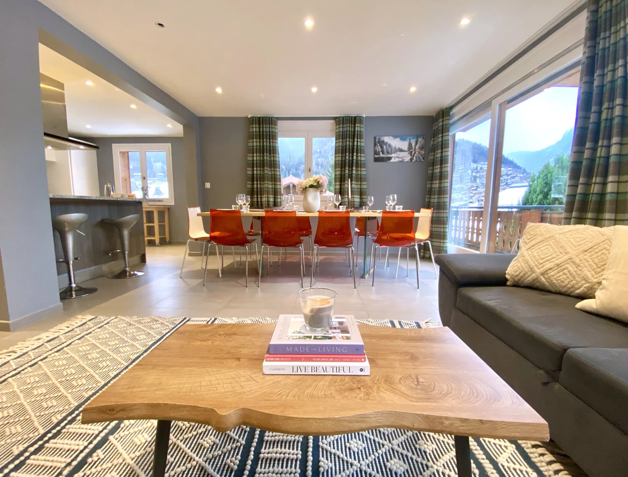Open-plan living and dining room with mountain views