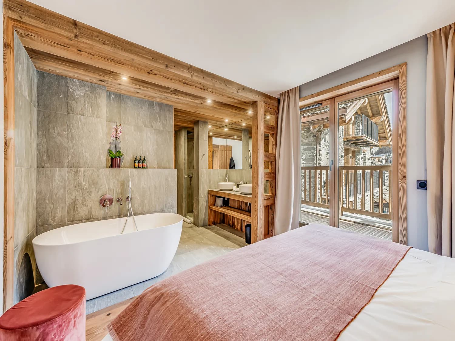 Primary bedroom with freestanding bath and balcony