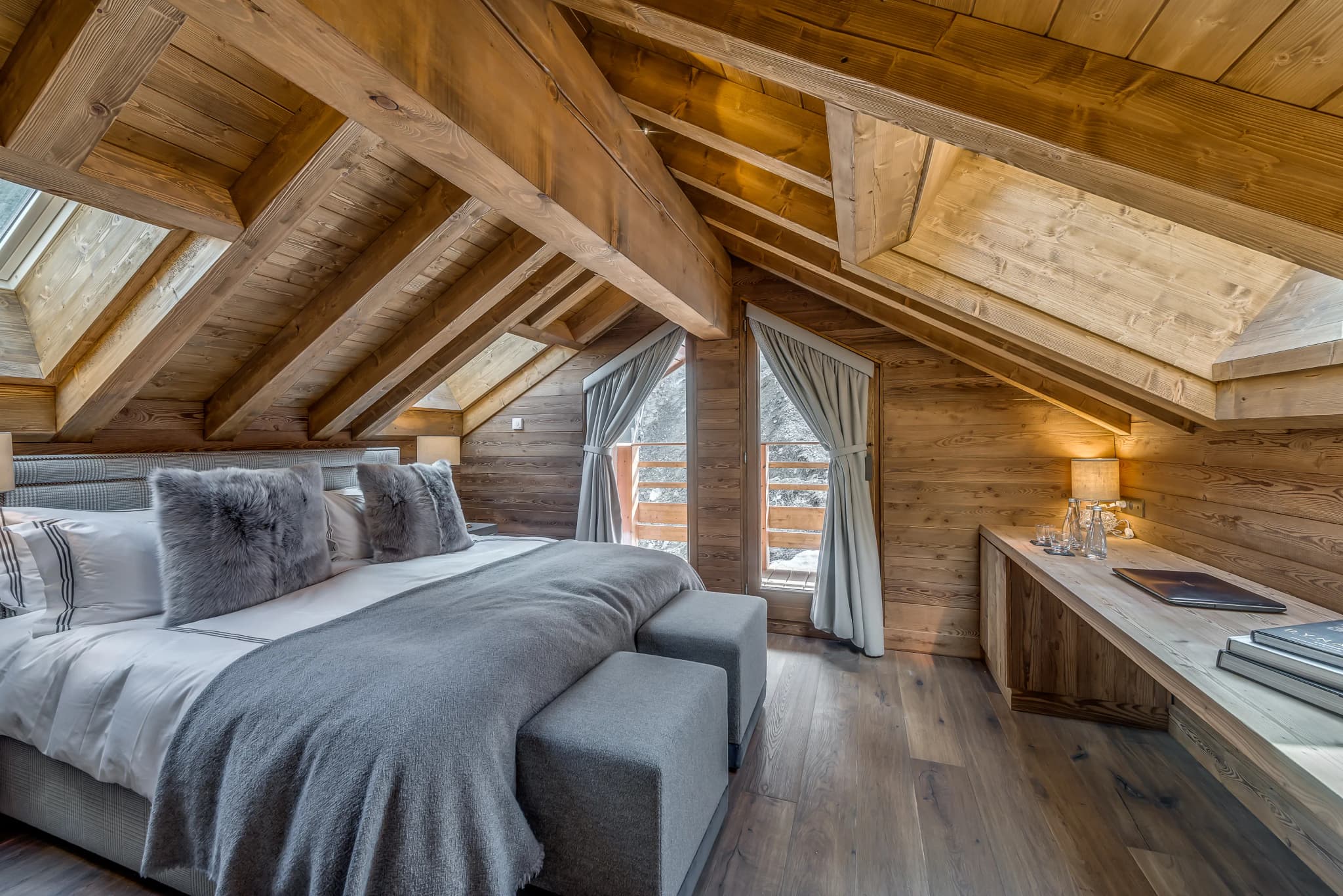 Double bedroom beneath the pitched timber ceiling