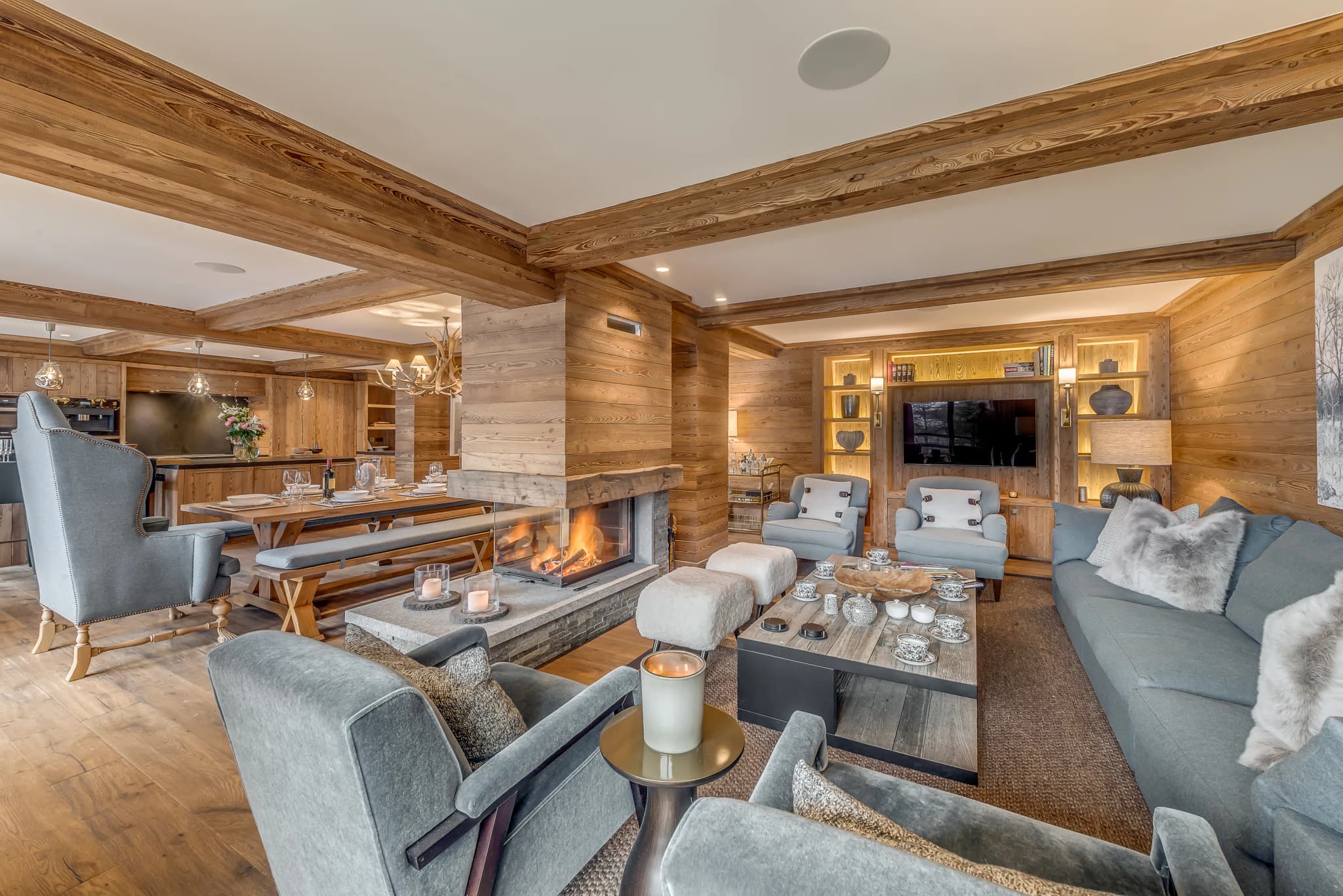 Open-plan fireside lounge with timber finishes