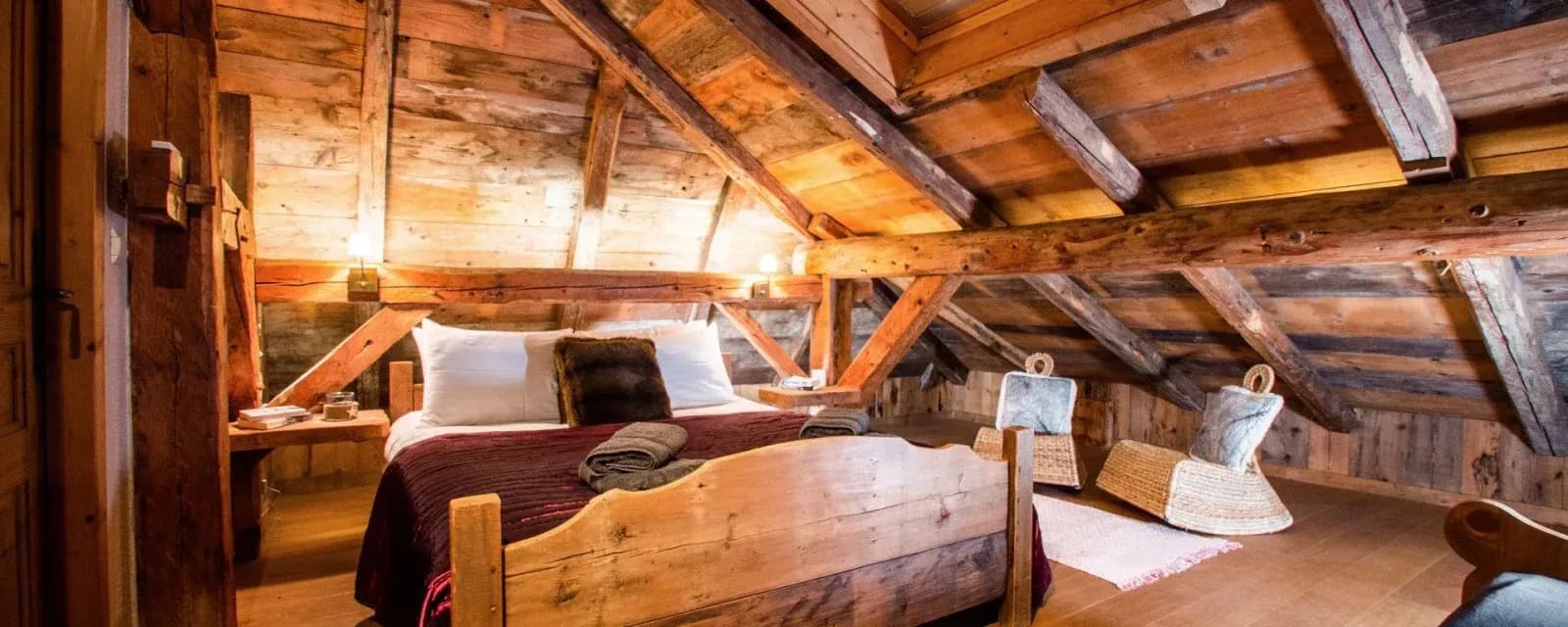 Top-floor king or twin bedroom beneath the sloping timber roof