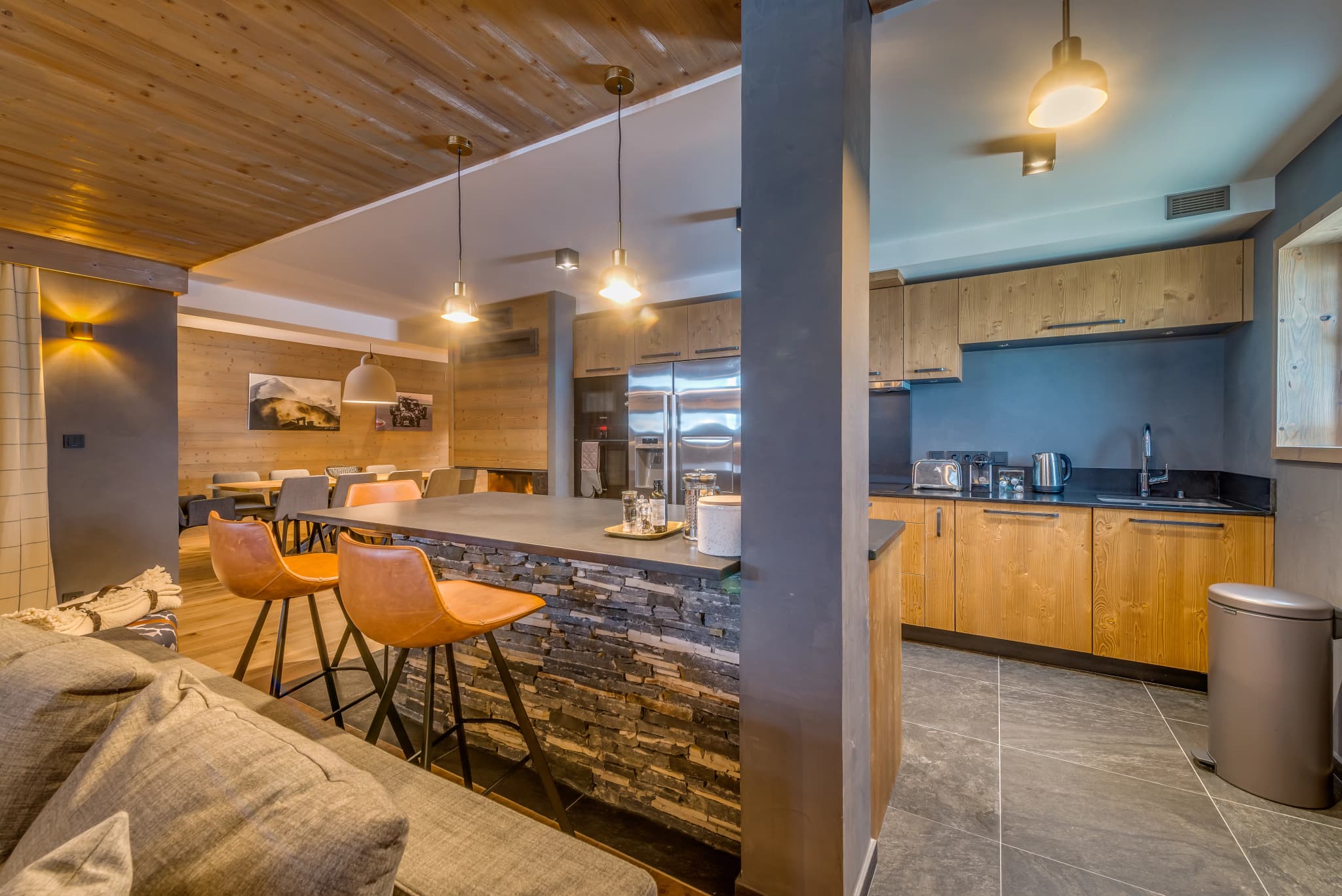 Open kitchen with a breakfast bar and wine fridge