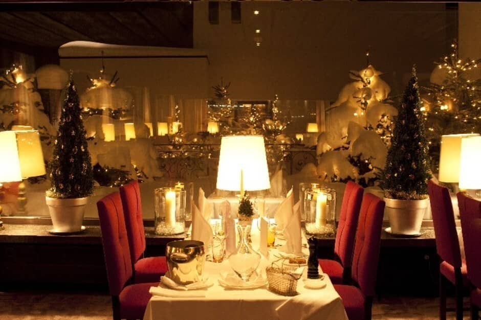 Dining area with seating for 4 and snow-covered terrace views
