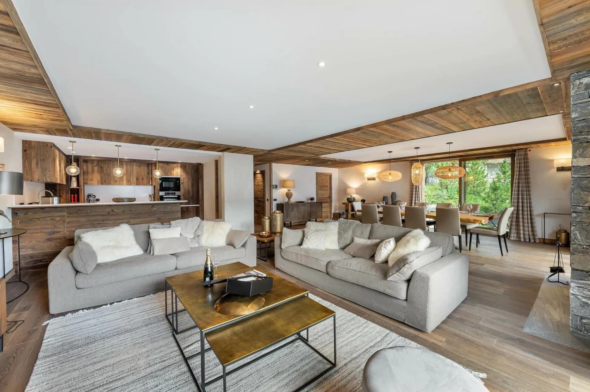 Living room with two sofas beside the open kitchen