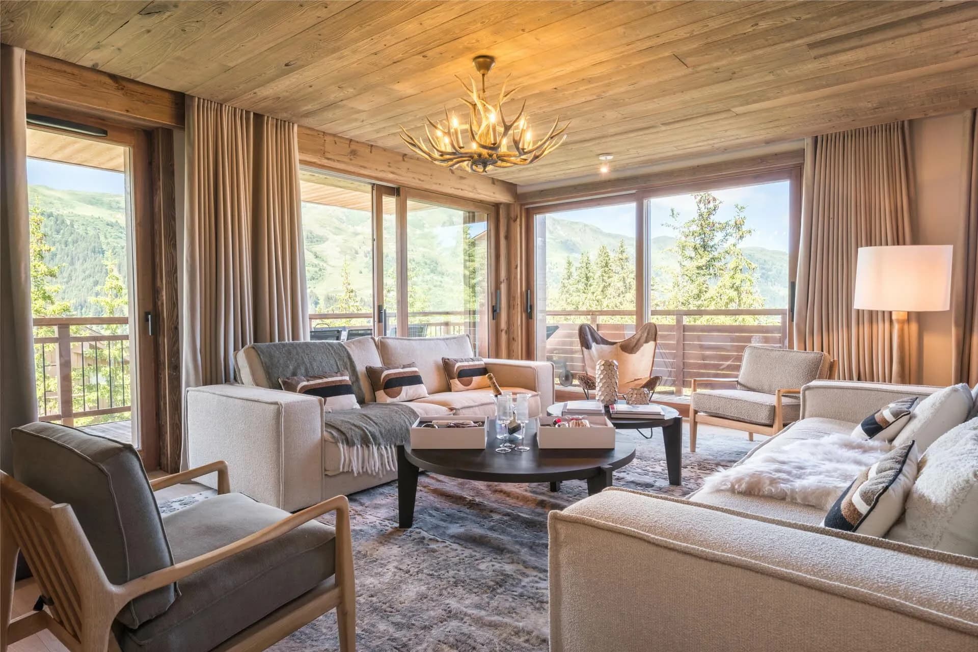 Living room with balcony access and mountain views