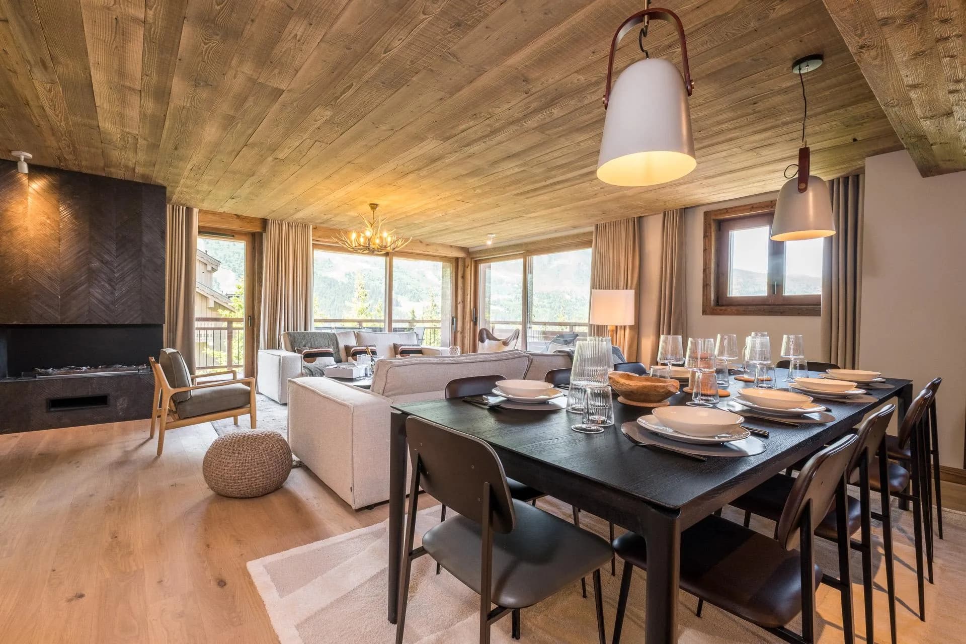 Dining area beside the fireplace and mountain views